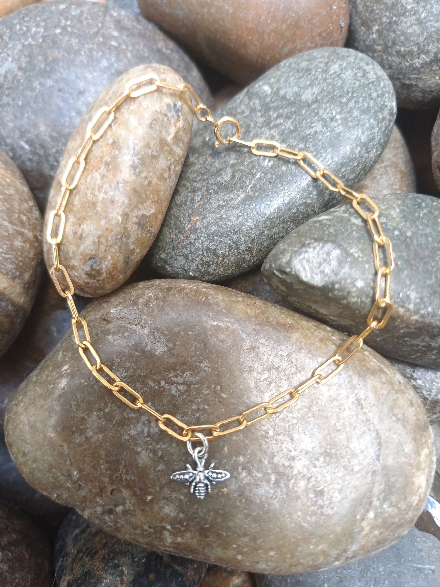 silver bee on gold